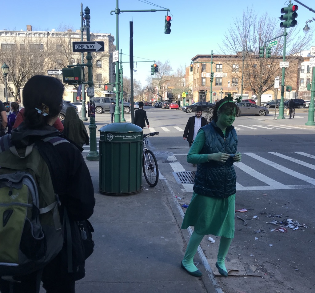 Photo of woman dressed as a clover in celebration of Purim.