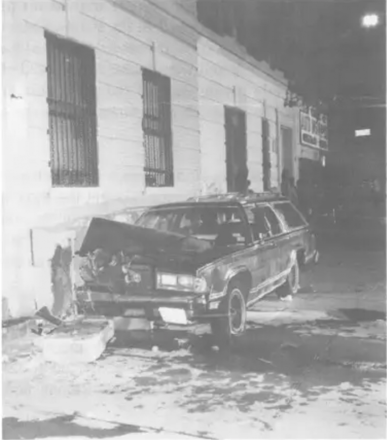 Photo of Yosef Lifsh’s station-wagon against the wall 
