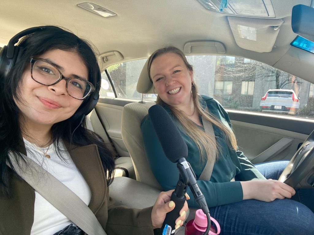 Daniela Cobos and Ann Schmidt sitting in the car after they've arrived in Albany.